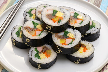 Gimbap is a Korean food consisting of rice and several ingredients seasoned with sesame oil and wrapped in nori seaweed.