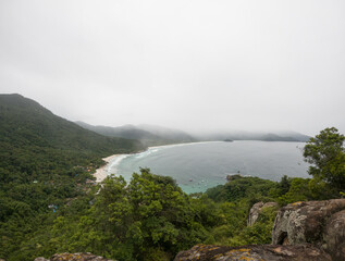 fog over the mountains in beach landscape