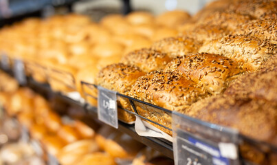 fresh golden breads on the shelf of the bread section of the supermarket