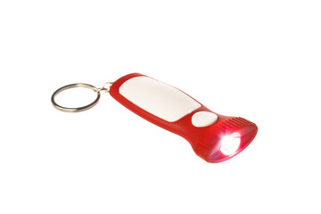 Llaveros de pl&aacute;stico con linterna en fondo blanco.