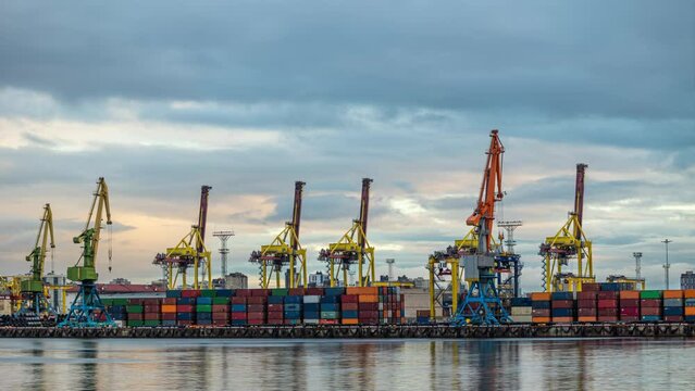 cargo loading cranes in seaport, container transportation and cargo ships. logistics and delivery of cargo and fuel