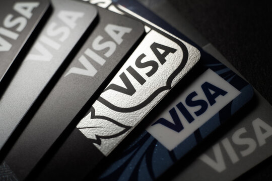 Close-up of Visa credit cards placed on a dark background. Macro photo. Moscow, Russia - March 14, 2022.