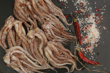 raw squid tentacles background closeup photo