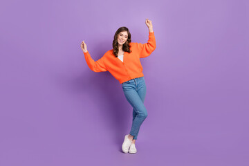 Full length photo of positive youngster hands up vibe chill rhythm music lover carefree wear stylish clothes isolated on purple color background