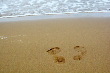 Female footprints in the sand