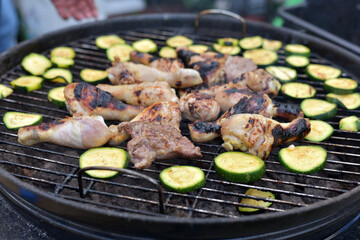 The vegetables are grilled. Meat on the grill