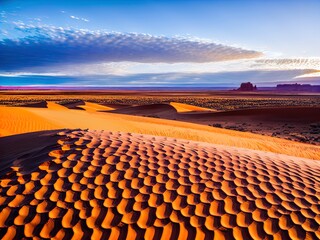 Fototapeta premium A desert with sand dunes and mountains in the distance.