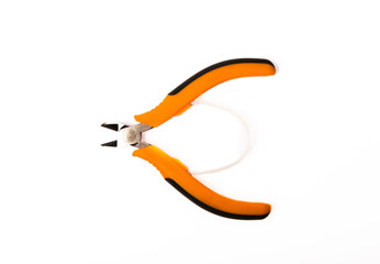 Wire cutters with orange handles isolated on white background