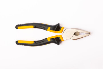 Pliers. Yellow and black pliers isolated on white background.