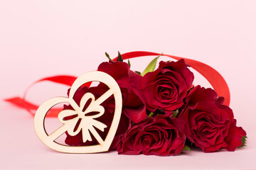 Valentines day red roses with decor on color table