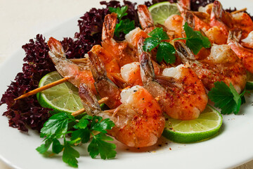 Shrimp kebab, with spices, lime, on wooden skewers, top view, no people,