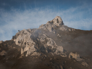 Mountain of Asturias with blue sky with few clouds. Mountains with fog