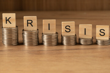 The word INFLATION on wooden cubes on a wooden background in the idea for the FED to consider raising interest rates, the world economy and the fight against inflation, U.S. dollar inflation