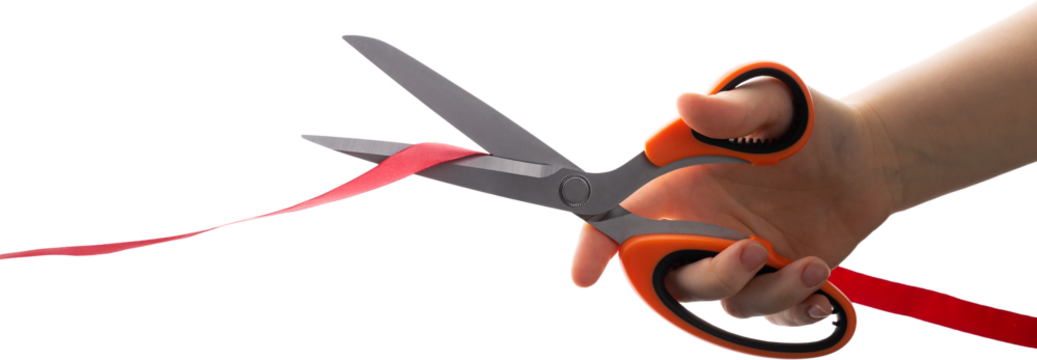 Cutting a red ribbon with scissors on a white background. Opening procedure, inauguration, new project.