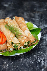 ruddy pancakes with green onions and egg on a metal background