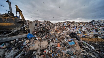 Work of a bulldozer at a landfill.