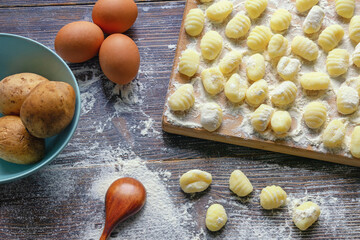 Balkan cuisine. Cooking of homemede Njoke ( gnocchi, dumpling ) from potato. Ingredients