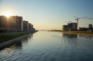 28.06.2022 St. Petersburg. the city in the evening rays. Buildings on the banks of the river.