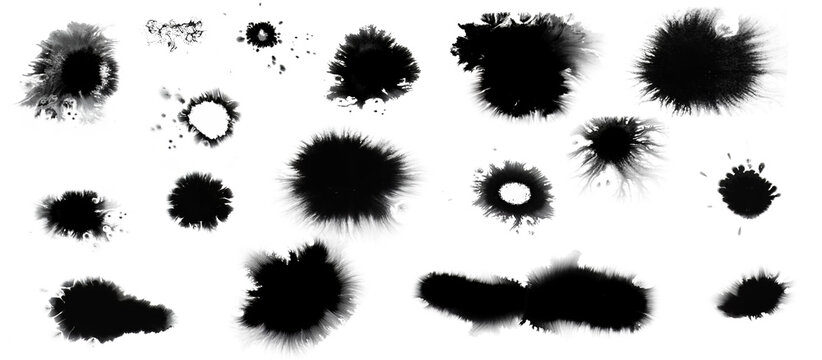 Collection of small and large black dried ink spots or inkblots