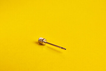 Needle for inflating the ball. Sports equipment.