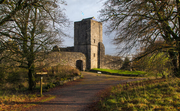 Mugdock Castle ruins, Glasgow, Scotland, seen through trees in winter