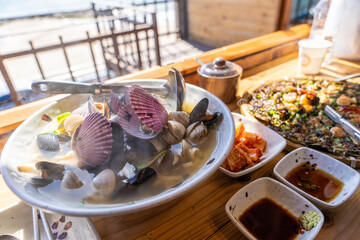 Korean-style hot seafood noodles with various seafood such as clams and mussels
