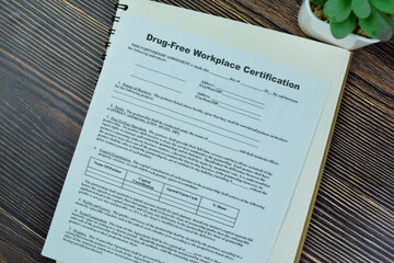 Concept of SBA Form Drug-Free Workplace Certification isolated on Wooden Table.