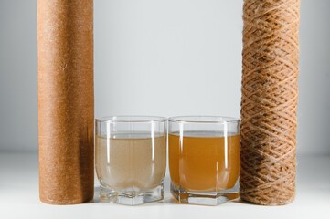used water filters, glasses with dirty water