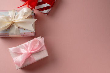 Valentine's day gift pink boxes and pink satin bow, copy space, birthday, Mother's Day