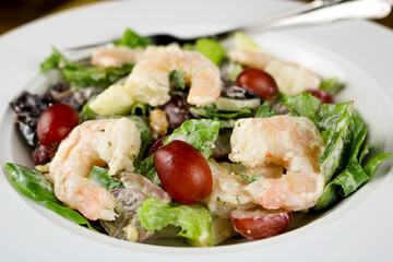 A freshly made Waldorf salad with shrimp.