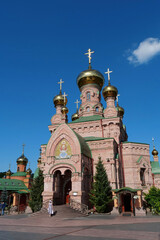 Fototapeta na wymiar People in Holy Intercession Monastery, Goloseevsky Hermitage, Kyiv, Ukraine