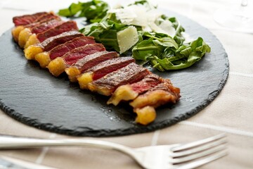 Italian tagliata steak with parmesan and rucola	
