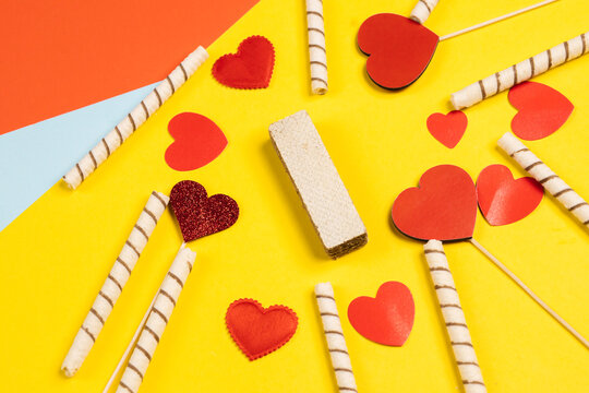 Valentine's Day. Frame of gifts, candles, confetti on a colorful background. Valentine's day background.