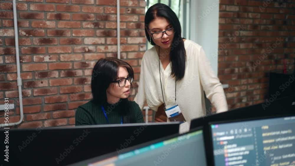 Wall mural female front-end developer and data scientists working in office of it-company, designer of website