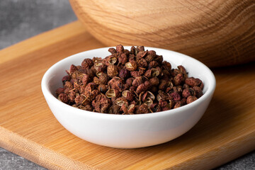 Chinese pepper, Sichuan pepper in wooden spoon. Dry Sichuan Pepper Spice.