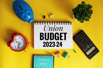 Union budget 2023 - 24. text on open notepad on office wooden table with different stationery