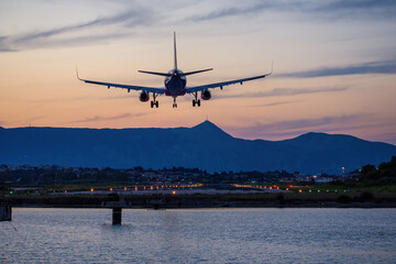 Fototapeta na wymiar Corfu, Greece - July 8, 2021: A passenger airplane at the international airport on dundry. Corfu. Greece. 