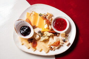 Cheese set with  jam, fruit and nuts