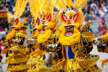 Dancers with typical devil costumes and other representations celebrate the festival of the Virgen de la Candelaria in Puno, Peru.