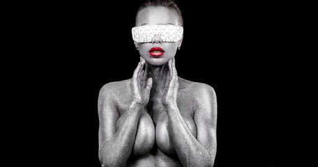 Hot girl DJ in neon lights with glasses and headphones. Beautyful woman in violet paint on her face and body. Portrait of sexy TDJ at club party.