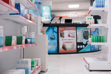 Empty pharmacy equipped with medicaments containers and supplements packages, retail shop shelves...
