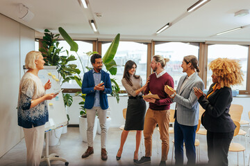 Fototapeta premium Businesspeople celebrate coworkers success.