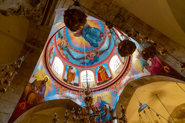 A small colorful dome showing Jesus inside the Church of the Holy Sepulcher in the old city of...