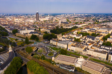 Fototapeta premium View from drone of old and modern houses of Nantes town at summer day, France