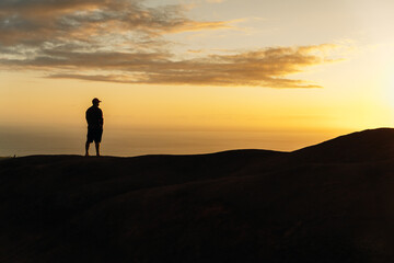 silhouette of a man on a sunset background