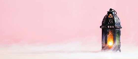 Ramadan Kareem banner design with lantern on pastel pink background with smoke. Eid Mubarak, Muslim Holy Month greeting card template. © photoguns