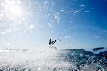 Kite Surfer Mayeul Riffet in action on a foiling kiteboard, Lorient, Brittany, France.