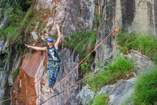 Woman balancing on slackline, Dibs Quarry, Maripora, Sao Paulo State, Brazil