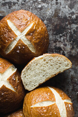 Pretzel buns on a baking sheet, German laugenbroetchen, lye buns on a baking tray
