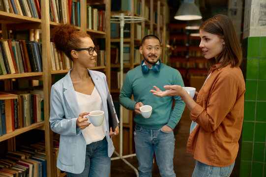 Diverse business team laughing cheerfully in coworking office